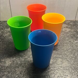 Set of 4 -7 oz Colorful Plastic Cups by Tupperware. Seem brand new.
